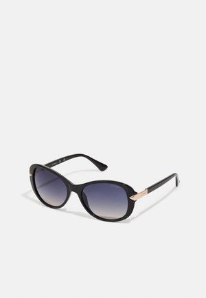 Black sunglasses with gradient lenses, rounded design, and glossy finish. Features rose gold accents on sides, enhancing overall look.