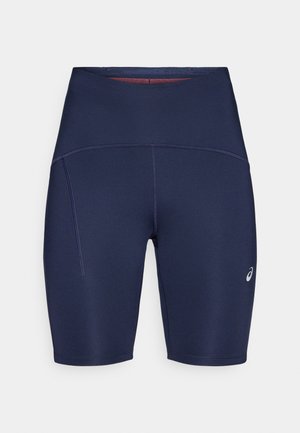 Tmavomodré športové kraťasy z pružného materiálu s vysokým pásom, bočnými švami a malým logom.