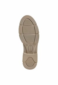 Semelle en caoutchouc beige avec une surface texturée, dotée de rainures horizontales et verticales pour l'adhérence et d'un design à bout arrondi.