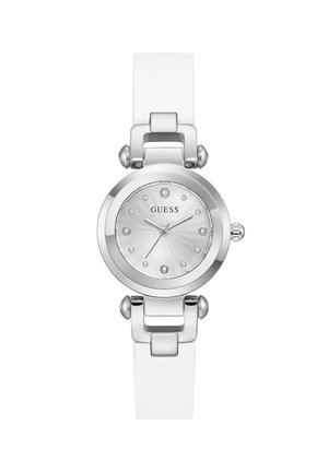 Montre-bracelet ronde en argent de la marque Guess avec un bracelet blanc, un cadran texturé, des index en cristal et trois aiguilles.