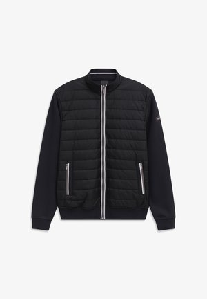 Black zip-up jacket with quilted front panel, long knit sleeves, two zippered front pockets, and a ribbed collar and cuffs.