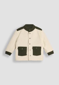 Fleece-takk i krem med grønne kordfløyelsdetaljer, med høy krage, trykknapper og to frontlommer.