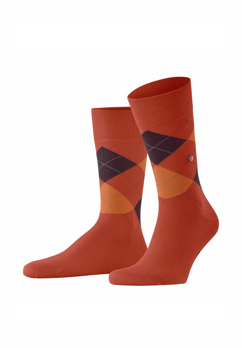 Chaussettes en coton orange avec un motif de losanges dans des nuances d'orange, de violet et de jaune, dotées d'une bordure côtelée et de détails cousus.