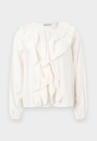 Blouse blanche avec un devant à volants, tissu doux, manches longues et fermetures à boutons. Présente un col structuré et des poignets froncés.