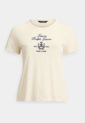 T-shirt crème à manches courtes en coton, avec un texte brodé en bleu foncé : "Lauren Ralph Lauren EST. 1996 NEW YORK" et un détail de logo.