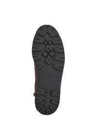Semelle de botte marron avec un relief profond et structuré pour une meilleure traction. Fabriquée en caoutchouc noir plat et durable, indiquée en taille 37. Côtés lisses et arrondis.