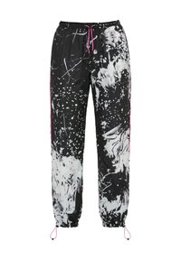 Pantalon de jogging noir avec motif éclaboussures de peinture blanche, cordons roses à la taille et aux chevilles, et ourlets élastiques pour un ajustement réglable.