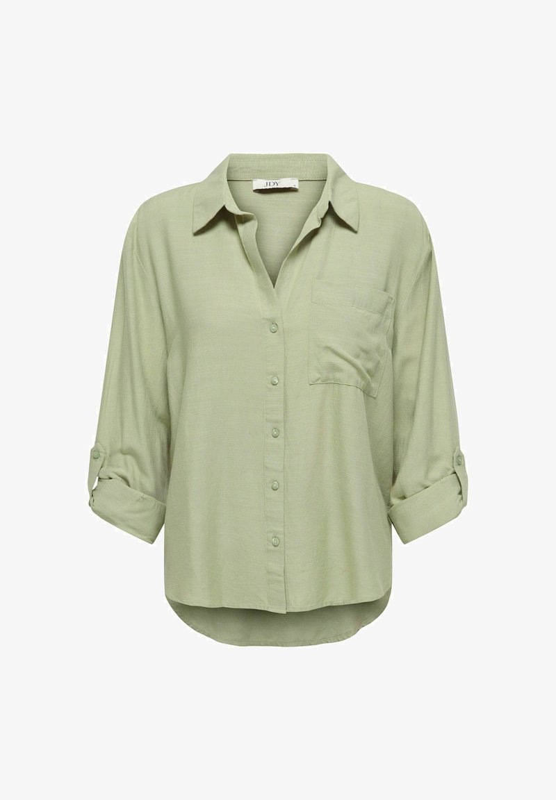 Chemise vert clair à boutons, avec col, poche poitrine et manches retroussées aux trois quarts. Texture douce avec une coupe décontractée.