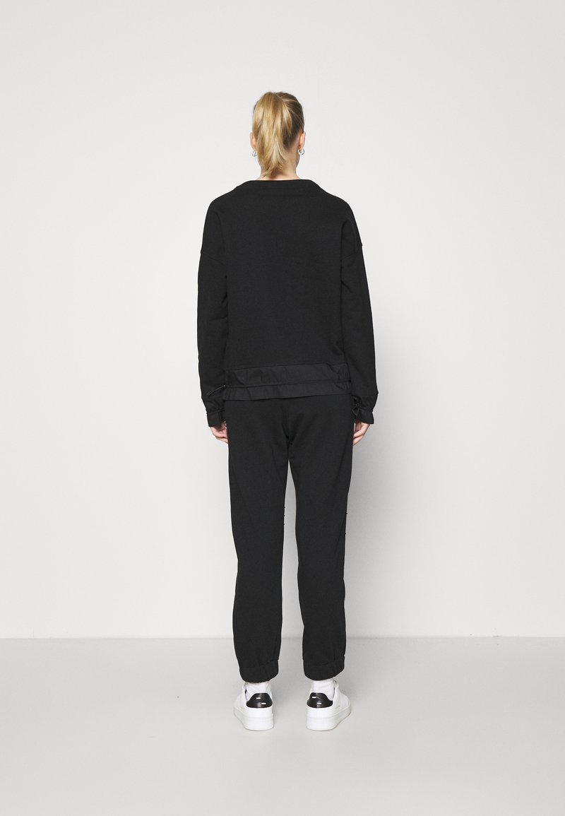 Damen Bekleidung | Dear Freedom TRACK PANTS Jogginghose black/schwarz - HY52992 Damen Bekleidung | Dear Freedom TRACK PANTS Jogginghose black/schwarz - HY52992
