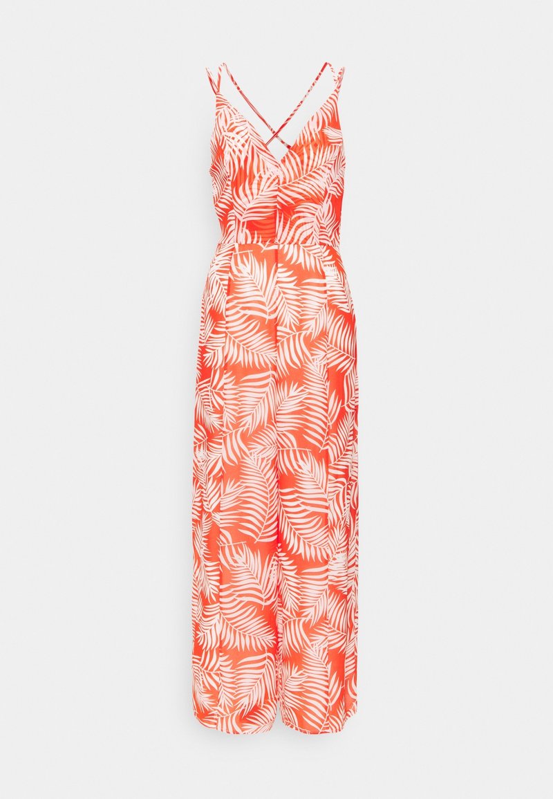 Oranžový overal bez rukávů s bílým tropickým vzorem listů a tenkými kříženými ramínky, vystavený na jednobarevném pozadí.
