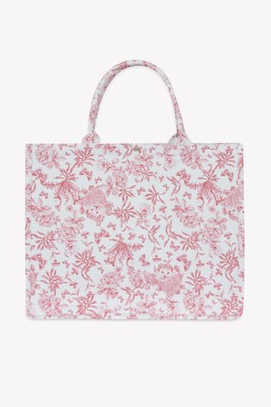 Cvetasta torba za na rame z rdečim in belim vzorcem, ima dva ročaja in pravokotno obliko. Narejena je iz tkanine z teksturirano površino.