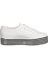 White canvas sneaker with a rounded toe, lace-up front, and a thick black-and-white striped platform sole. Textured fabric on upper.