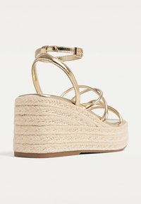 Stradivarius Espadrilles - gold coloured