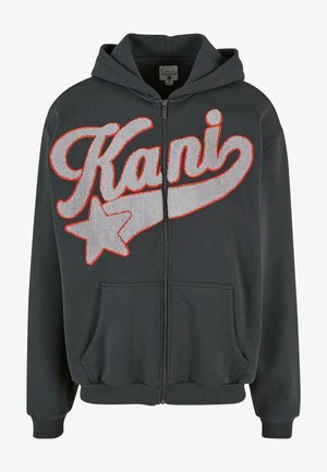 Grijze hoodie met ritssluiting, voorzien van geborduurde "Kani" en ster ontwerp in grijs en oranje. Het heeft een kangoeroezak en een verstelbare capuchon.