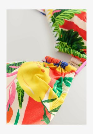Barvni bikini zgornji del s tropskimi cvetličnimi vzorci, pretežno rumen z rdečimi, zelenimi in roza poudarki, izdelan iz raztegljive tkanine.