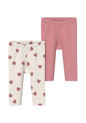 Two pairs of ribbed baby leggings, one solid dusty pink and one white with scattered pink heart patterns.
