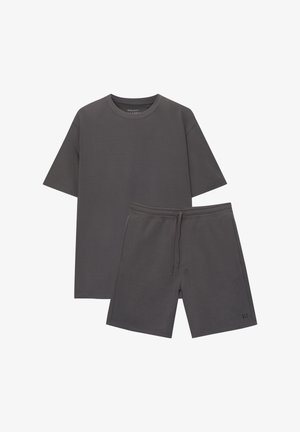 Gray cotton t-shirt with a regular fit and short sleeves, paired with matching gray shorts featuring a drawstring and side pockets.