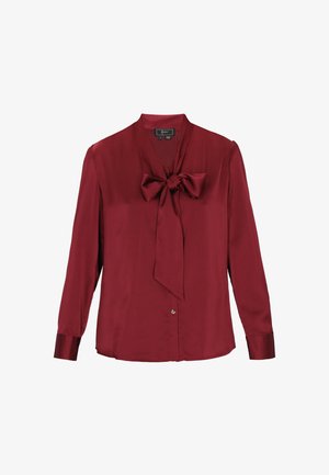 Burgundy silk blouse with long sleeves, button closure, and a bow tie detail at the neckline. Smooth texture, classic design, and tailored fit.