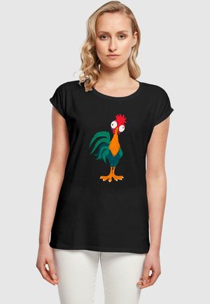 Black t-shirt with short rolled sleeves featuring a colorful cartoon rooster graphic. The rooster has large eyes, a red comb, and a vibrant feather pattern.