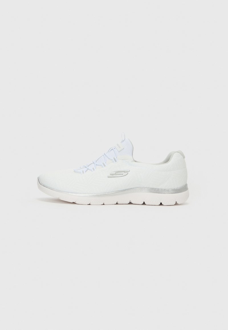 White athletic shoe with a textured knit upper, silver accents, elastic lace design, and a cushioned sole with ridged tread.