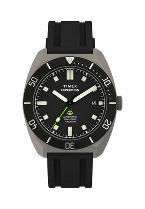 Timex Expedition wristwatch with black dial, luminous hands and markers, black bezel, date display, and black silicone strap.