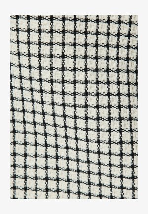 Geweven stof met een zwart-wit ruitpatroon en gestructureerde vierkanten. Het ontwerp toont afwisselend geweven materialen voor visueel contrast.