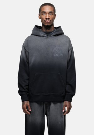 Sweat-shirt à capuche dégradé noir à gris, en mélange de coton avec poche avant, détail du logo imprimé, coupe décontractée et texture douce.