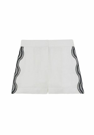 Baltos šortai su lygiu paviršiumi, šonuose puošiami bangelėmis austais juodais nėriniais ir turintys struktūruotą liemens juostą.