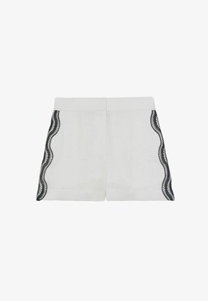 Baltos šortai su lygiu paviršiumi, šonuose puošiami bangelėmis austais juodais nėriniais ir turintys struktūruotą liemens juostą.