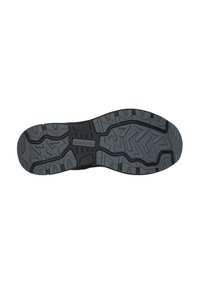 De buitenzool van de sportschoen heeft een gestructureerd, zwart rubberen ontwerp met diepe loopvlakken en groeven voor grip en stabiliteit. De merknaam is zichtbaar.