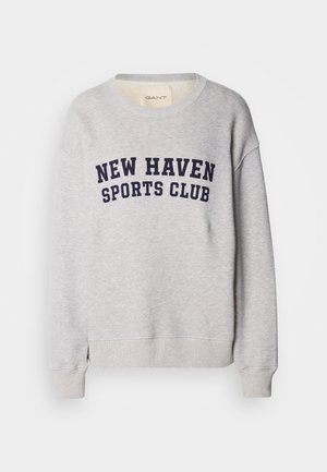 Világosszürke kapucnis pulóver, pamut keverékből készült, sötétkék felirattal: "NEW HAVEN SPORTS CLUB" az elején. Bordás mandzsetta és hem.