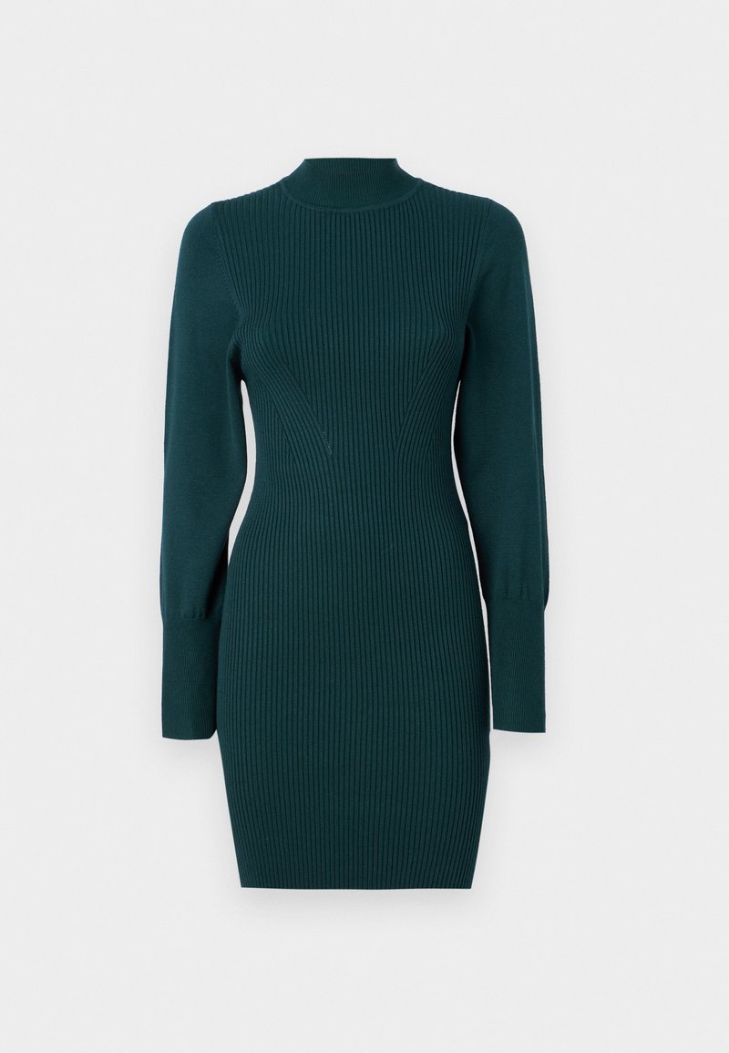 Brede trui jurk in diep teal met ribbeltextuur. Heeft een hoge halslijn, lange mouwen en een slim-fit silhouet. Lengte tot halverwege het dijbeen.