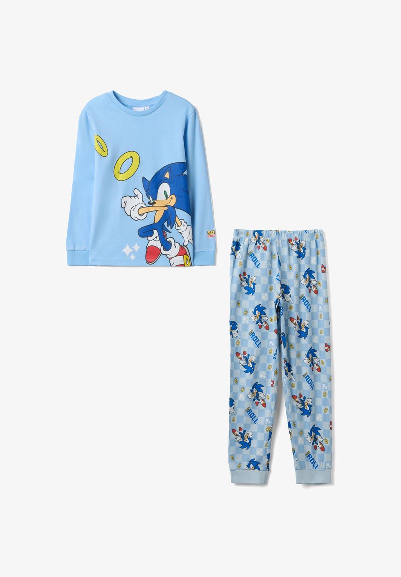 Hellblaues Set aus langärmligem Oberteil und Hose mit Sonic the Hedgehog und gelben Ringen, wobei Sonic auf der Hose in verschiedenen Actionposen dargestellt ist.