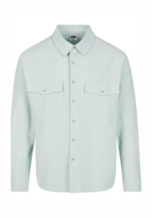 Camicia button-up verde menta chiaro con colletto strutturato, due tasche sul petto e maniche lunghe, realizzata in un tessuto morbido e strutturato.