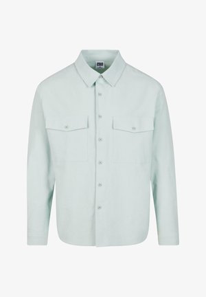 Camicia button-up verde menta chiaro con colletto strutturato, due tasche sul petto e maniche lunghe, realizzata in un tessuto morbido e strutturato.