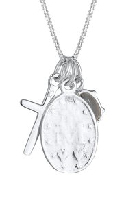 Silver pendant necklace featuring an oval charm with textured surface, a small cross, and an additional circular accent. Chain is also silver.