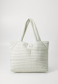 Striped tote bag in light cream with green and navy lines, padded texture, dual handles, and a button detail at the top center.
