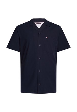 Navy blue short-sleeve button-up shirt with a pointed collar and chest pocket featuring a small red, white, and blue logo.