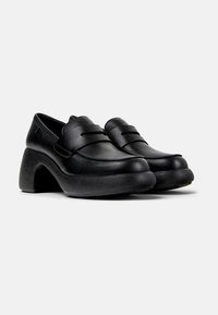 Black leather shoes with a rounded toe and raised heel. Features two horizontal straps across the upper and textured heel design.