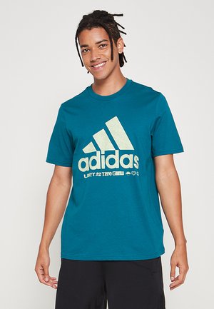 adidas Performance M UNITY G T - Camiseta estampada - legacy teal