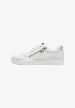 White sneakers with a textured upper, silver accents, and a side zipper. Features a low-profile, rubber sole with a patterned design.