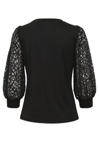 Haut noir avec des manches courtes en dentelle bouffante. Le corps est en coton noir uni, tandis que les manches présentent des motifs de dentelle complexes et des poignets côtelés.