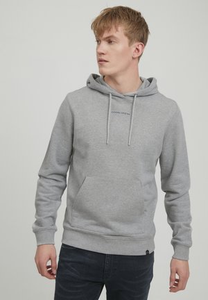 Gray hoodie made of soft cotton with a front pocket, drawstring hood, and embroidered text "CASUAL AVOID" on the chest.