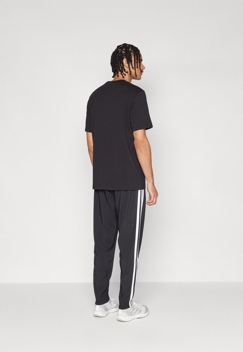 adidas ESSENTIAL THREE STRIPES - Tracksuit bottoms - black/white — foto 3