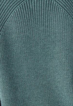 Knitted sweater in muted teal with a ribbed texture and curved shoulder design. Fabric appears soft, showcasing fine stitching details.