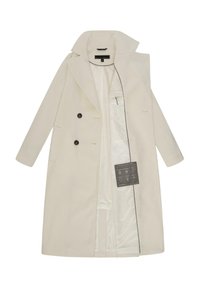 Weißer Wollmantel mit doppelter Knopfleiste, großem Kragen, schwarzen Knöpfen und seitlichen Taschen. Gefüttertes Innenleben mit Pflegehinweisen.