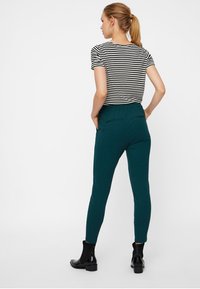 Vero Moda VMEVA STRING PANT NOOS - Tracksuit bottoms - evergreen