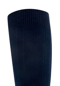 Chaussette bleu marine à hauteur de genou avec texture côtelée, dotée d'une couleur unie et d'un revers élastique pour un maintien sécurisé. Aucune motif ni accent visible.