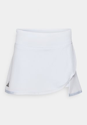 White athletic skirt with a smooth waistband, textured body, and asymmetrical hem. Features a subtle sheen along the edges and a logo tag.