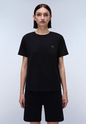 Black cotton t-shirt with short sleeves and a round neckline. Features a small logo on the left chest. Paired with black shorts.